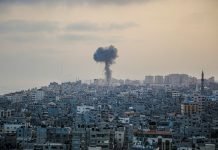 War or peace, the priority must be the hostages in the Gaza Strip and the ceasefire smoke billows from a factory in a city