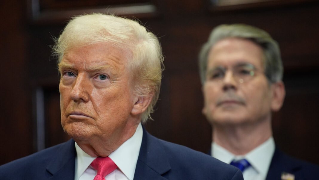US President Donald Trump in the foreground, and Scott Bessent, US treasury secretary, in the background.