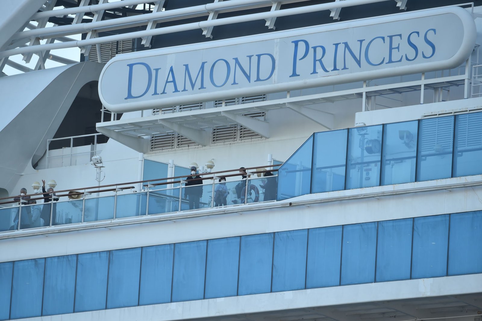 Passengers are seen on the deck of the Diamond Princess cruise ship in February 2020. Hundreds contracted Covid while on the ship, including more than 100 U.S. passengers