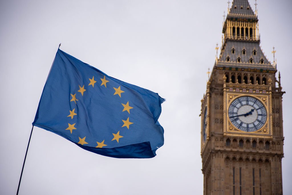 The EU flag is seen flying by Big Ben during a demonstration