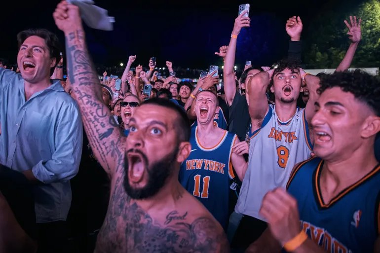 New York Knicks fans celebrate their victory as they watch Game 5 of the NBA Finals basketball series against the San Antonio Spurs, Saturday, June 13, 2026, in New York. (AP Photo/Andres Kudacki)
