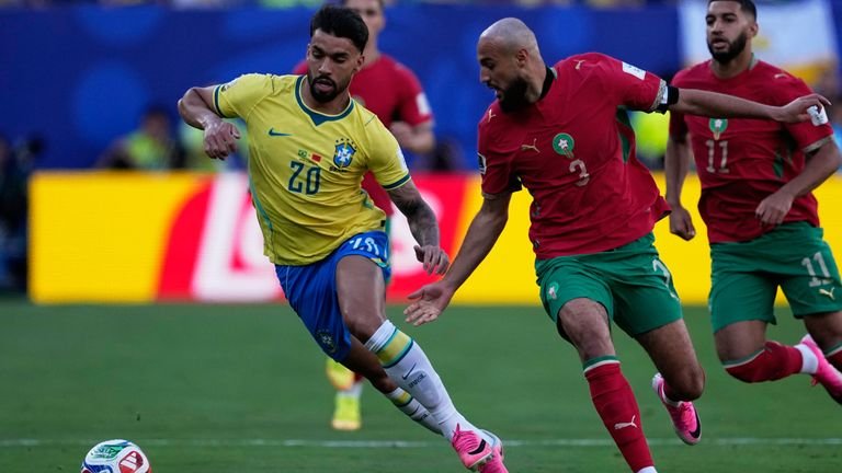 Brazil forced to settle for Morocco draw despite Vinicius stunner 1 Brazil's Lucas Paqueta, left, and Morocco's Noussair Mazraoui compete for the ball during the World Cup Group C soccer match between Brazil and Morocco in East Rutherford, N.J., near New York, Saturday, June 13, 2026. (AP Photo/Petr David Josek)