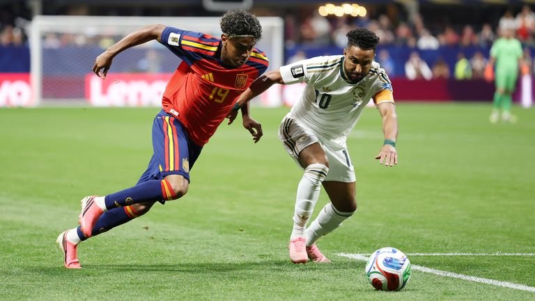 Spain's Lamine Yamal and Salem Al-Dawsari of Saudi Arabia compete for the ball