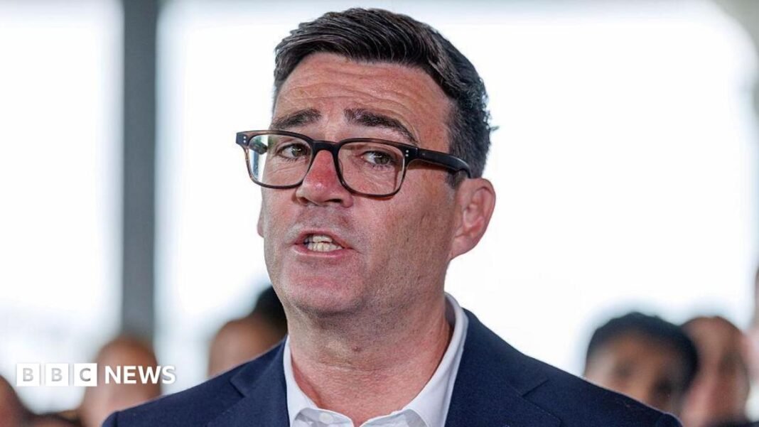 Andy Burnham to scrap digital ID to focus on cost Andy Burnham in a suit and glasses. A close up of his face.