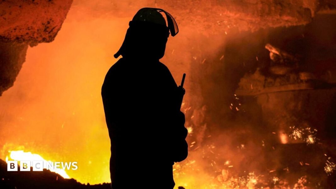 A silhouette of a steel worker