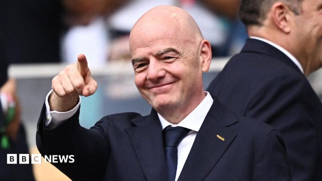 Lib Dems urge FA and Uefa to withdraw from Fifa FIFA President Gianni Infantino in the stands before the England vs Norway match in the World Cup