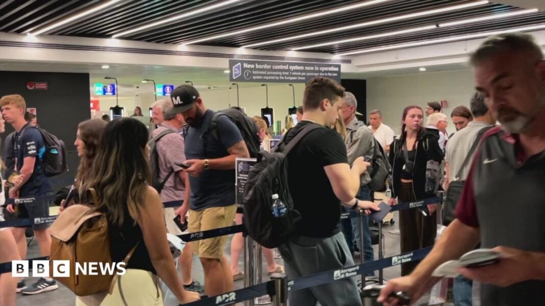 New EU border system tripling time at passport control, airport People move through the queue for the Entry Exit System process at Fuimicino Airport in Rome, Italy.