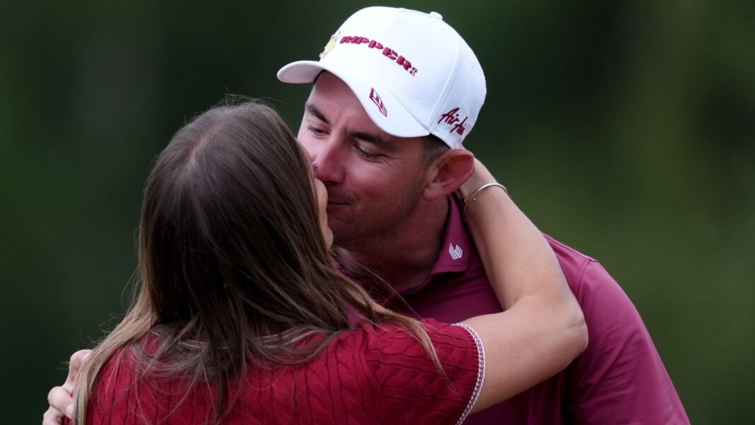 Lucas Herbert kisses his wife Erika Cote after winning LIV Golf UK (PA Images)