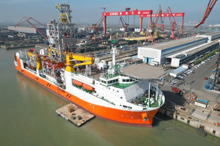Aerial view of China's Meng Xiang ultra-deepwater drilling vessel docked at a port.