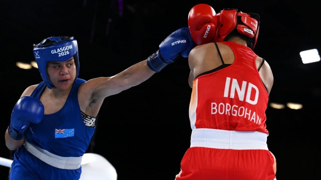 Boxer wins country's first medal without winning a fight Tarona Taafaki (right) lost 5-0 before claiming Commonwealth bronze in Glasgow