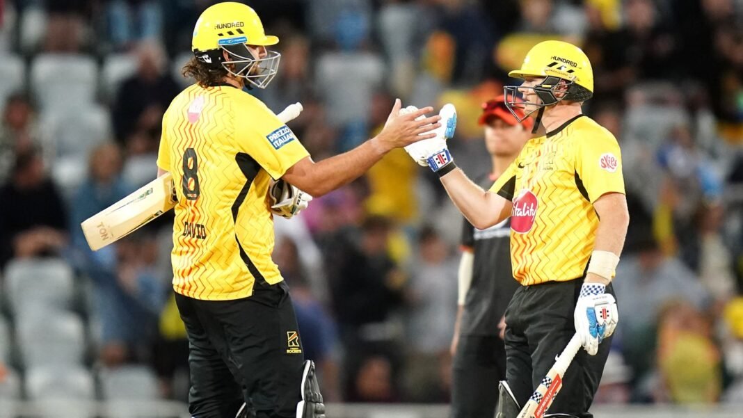 Rockets march on after easy win while Buttler makes history Trent Rockets' Tim David (left) and Sam Billings celebrate following victory against Birmingham Phoenix in The Hundred