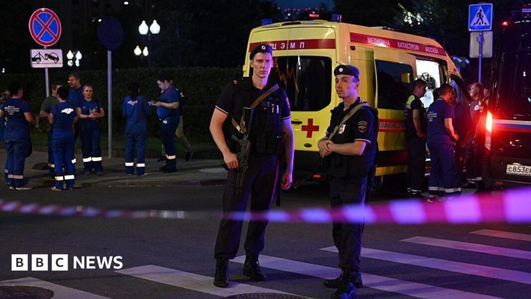 Three killed in Moscow restaurant explosion Armed Moscow police stand guard in front of an ambulance near the scene of an explosion near the centre of the city.